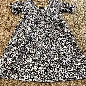 Black dress covered in white floral